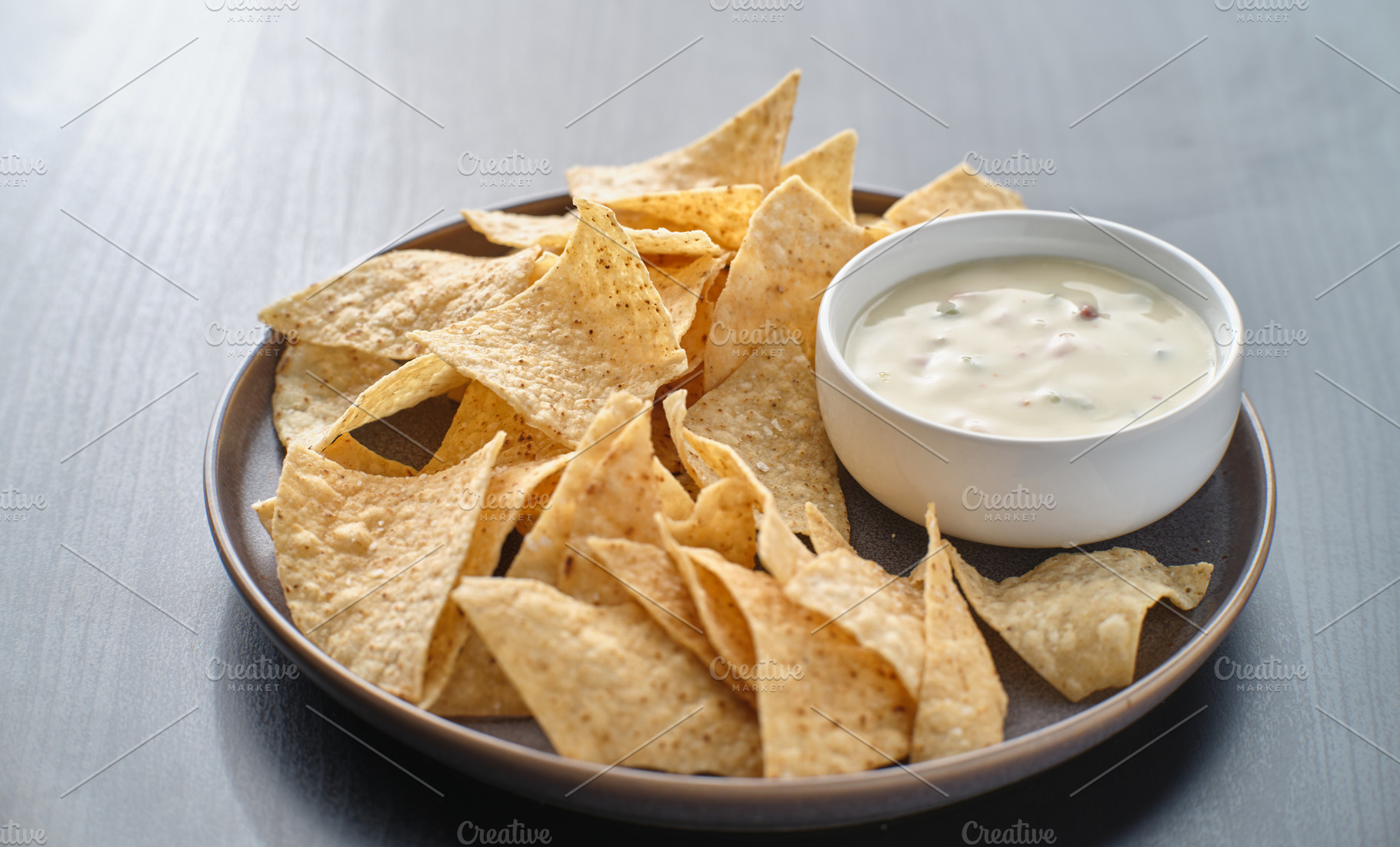 Queso blanco dip with chips containing food, queso blanco, and tortilla chips, a Food & Drink Photo by RezArt