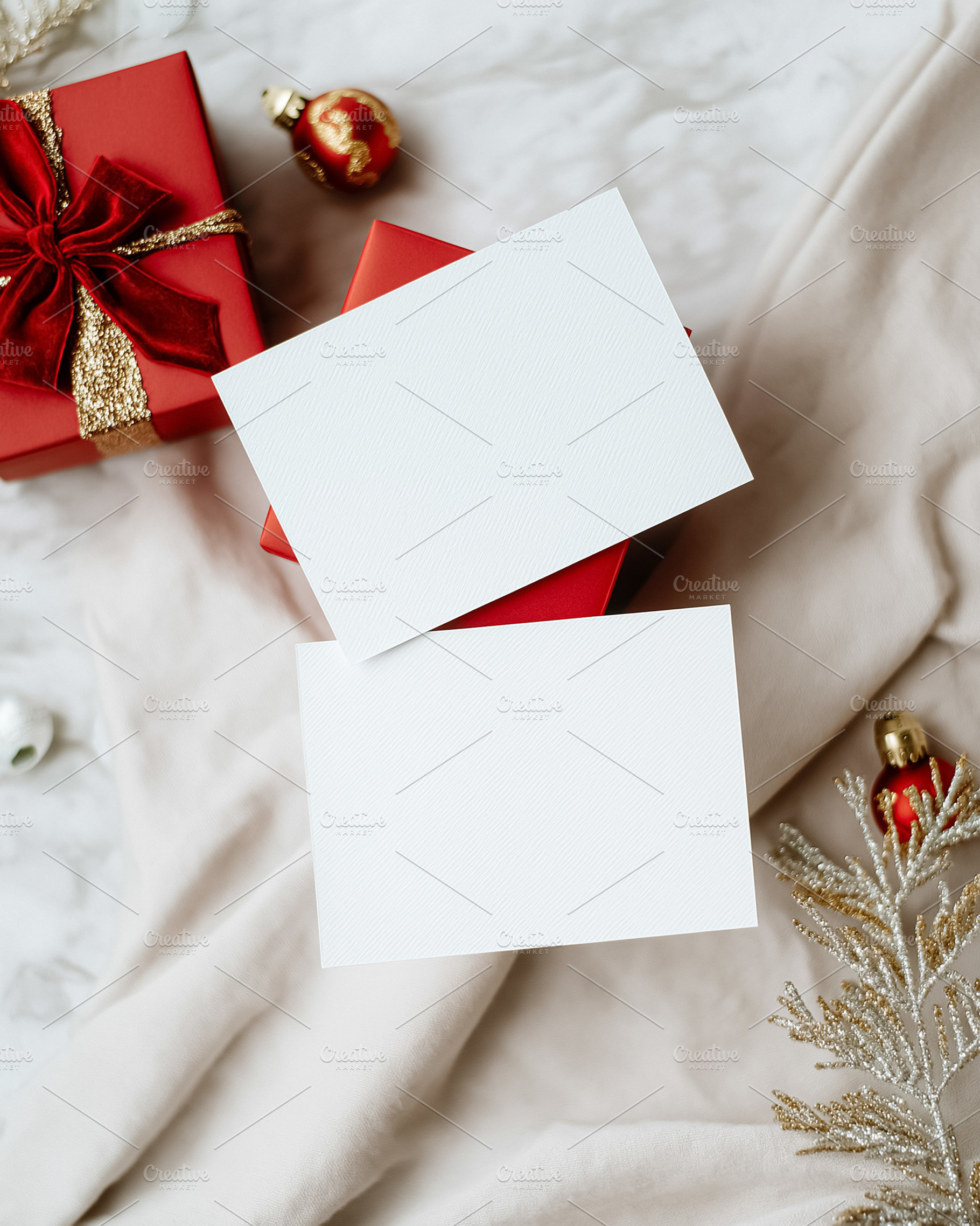 Holiday greeting card mockup with blank white paper on a red gift box and Chris, a Holiday Photo by Studio ANNA