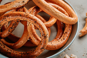 closeup of a plate with some romanian covrigi, a Photo by Nito