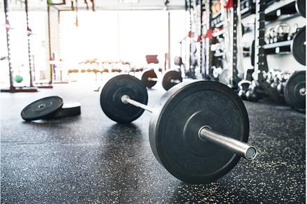 Rows of metal barbells on floor and, a Sports & Recreation Photo by HalfPoint