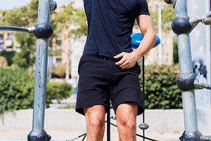 Smiling man on outdoor climbing frame, a Person Photo by RF Images