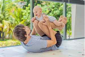 Father exercising with his small, a Sports & Recreation Photo by Elizaveta Galitskaya