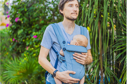 Young father walks in nature with