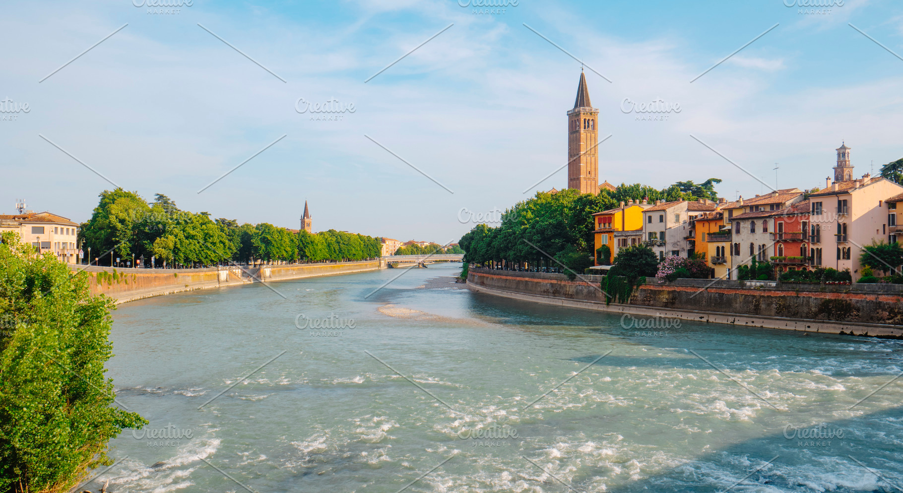 a wide view of the Adige River in Verona, Italy, a Photo by Nito