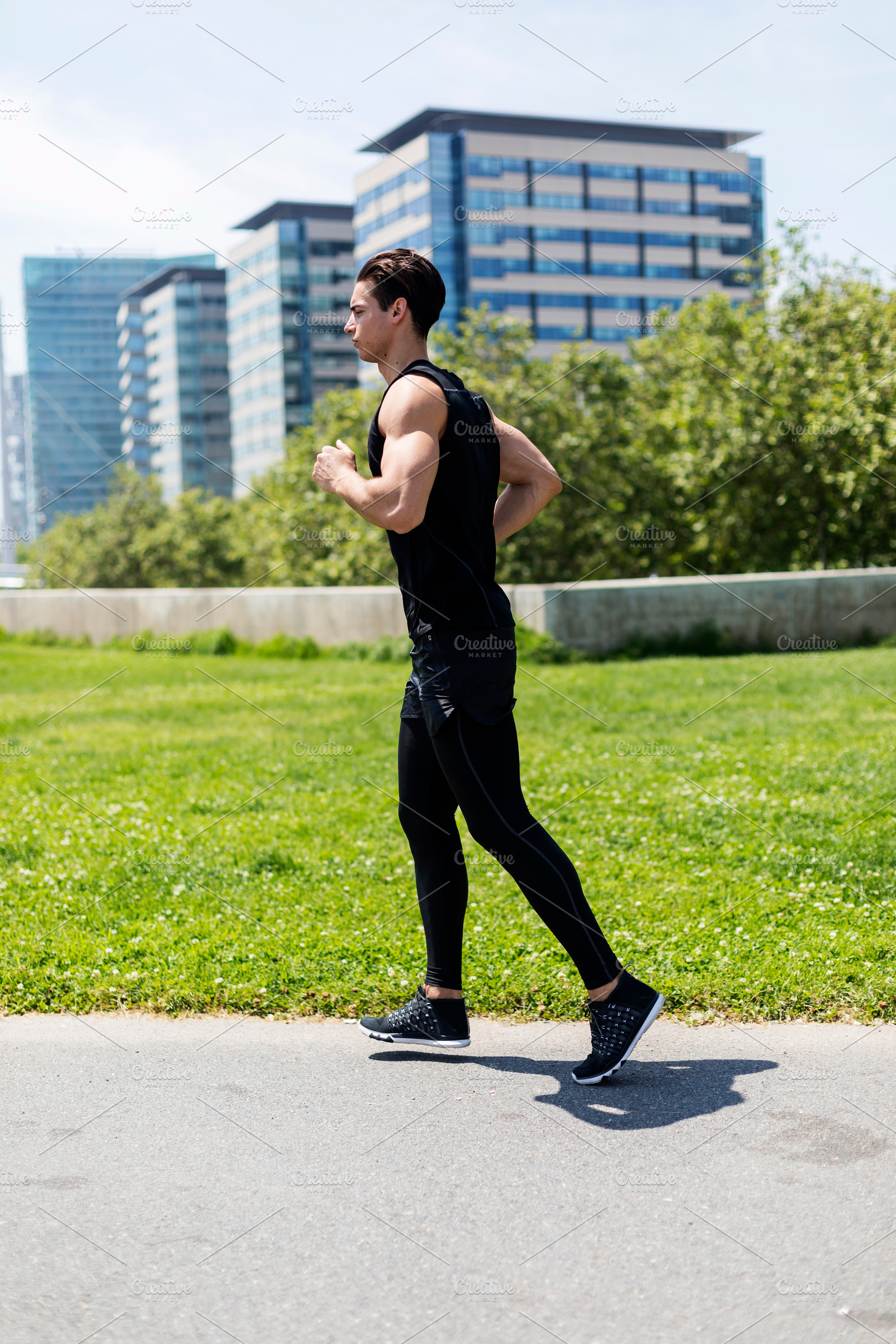 Male runner jogging in an urban park, a Person Photo by RF Images