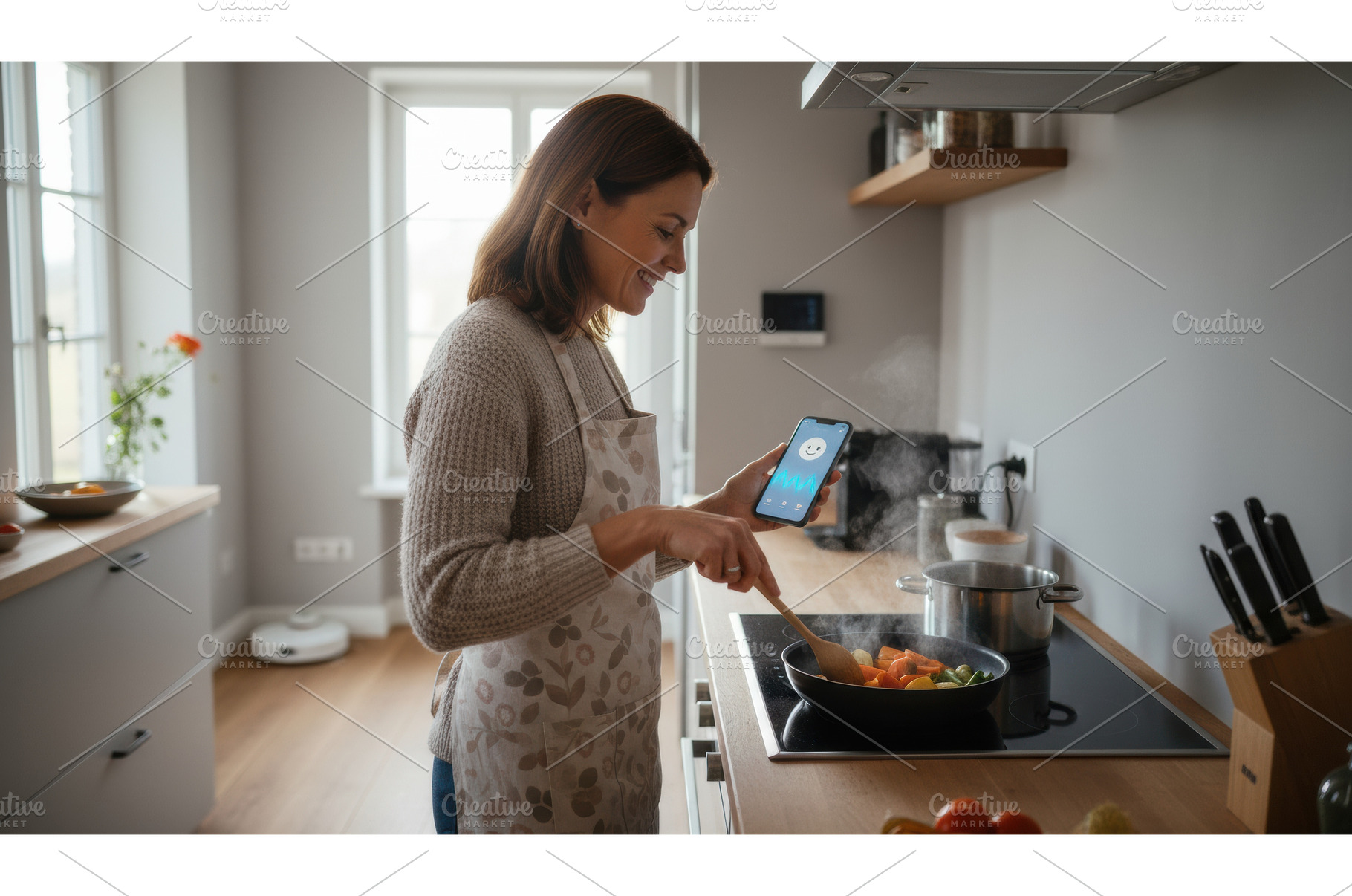 Smiling woman cooking vegetables in, a Food & Drink Photo by Igor Tichonow