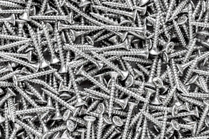 Metal screws background and texture, an Industrial Photo by BOOCYS