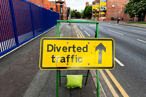Diverted traffic sign on a quiet urban street in Manchester UK i