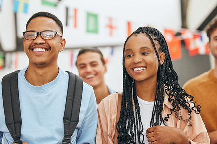 College friends, couple and happy students group at university for education, learning and knowledge together. Young, smile and black people gen z youth walking at campus for back to school studying, a Photo by Peopleimages.com