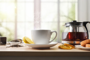Freshly poured tea on wooden table in room with window, a Food & Drink Photo by Davizro's Market