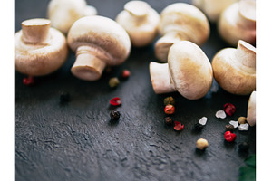 Mini champignons on black background, a Food & Drink Photo by Fascinadora