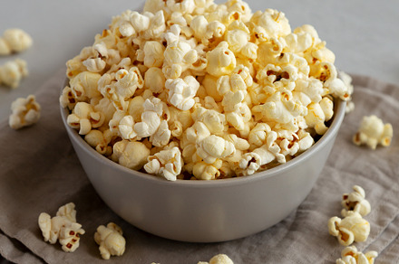 Homemade Salty Popcorn in a Bowl, side view., a Food & Drink Photo by LiudmylaChuhunova