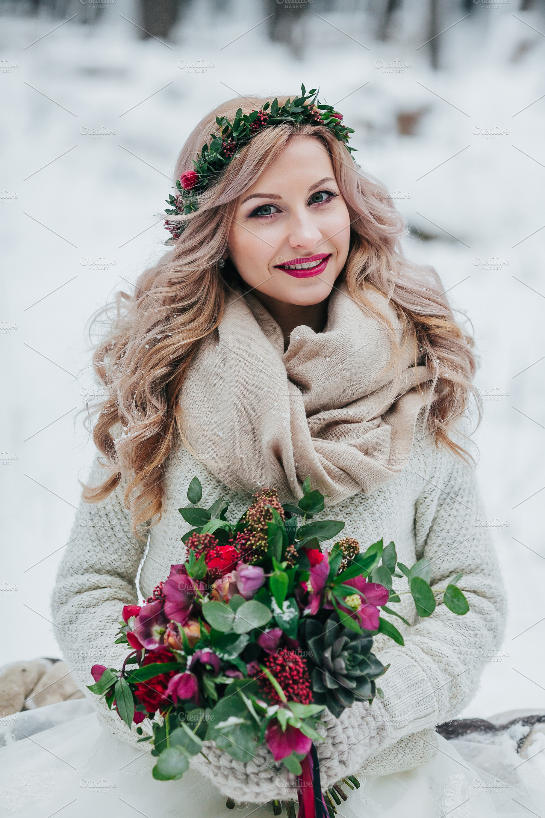 Beautiful smiling girl of Slavic appearance with a wreath of wildflowers holds a bouquet in winter background., a Beauty & Fashion Photo by Stahov
