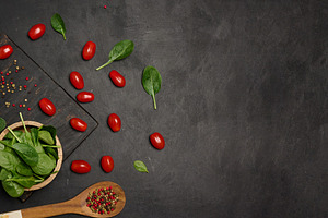 Fresh spinach leaves, cherry tomatoes, and mixed peppercorns on, a Food & Drink Photo by ndanko