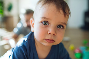 Curious baby boy with blue eyes, a Person Photo by HalfPoint