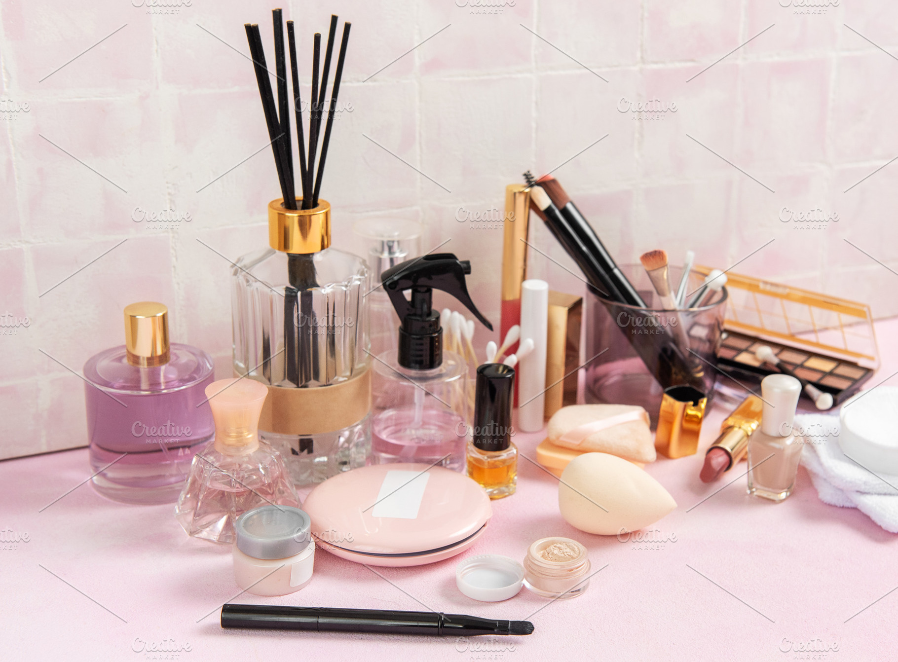 Cosmetic products and personal care accessories on pink surface, a Beauty & Fashion Photo by Olena Rudo