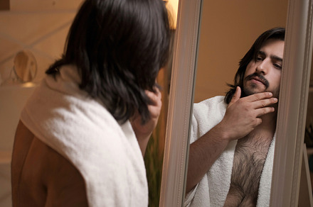 Man grooming beard care pensive guy face in mirror, a Person Photo by Photo Drive Studio