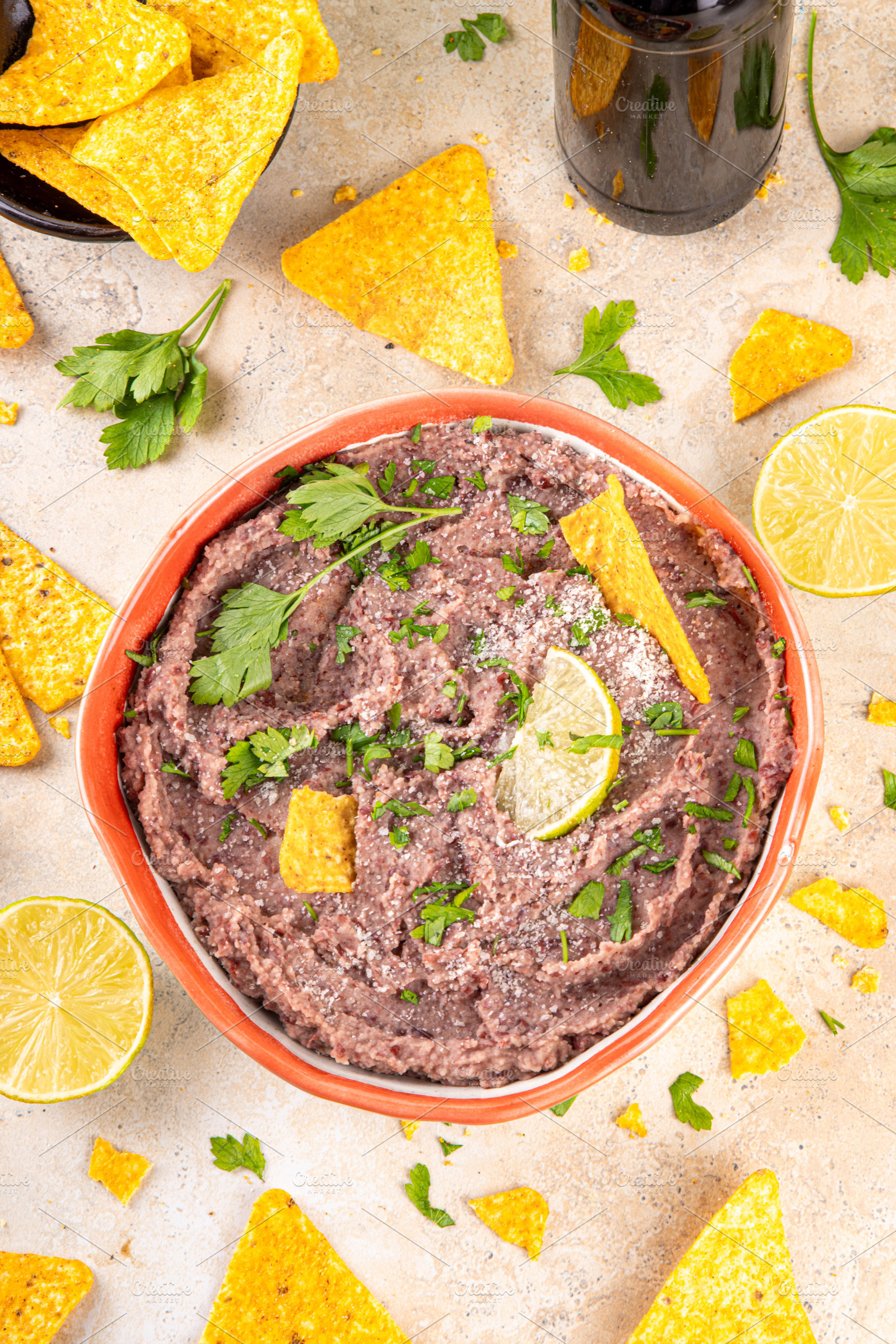Mexican homemade refried beans with tortilla chips nachos, a Food & Drink Photo by Rimma