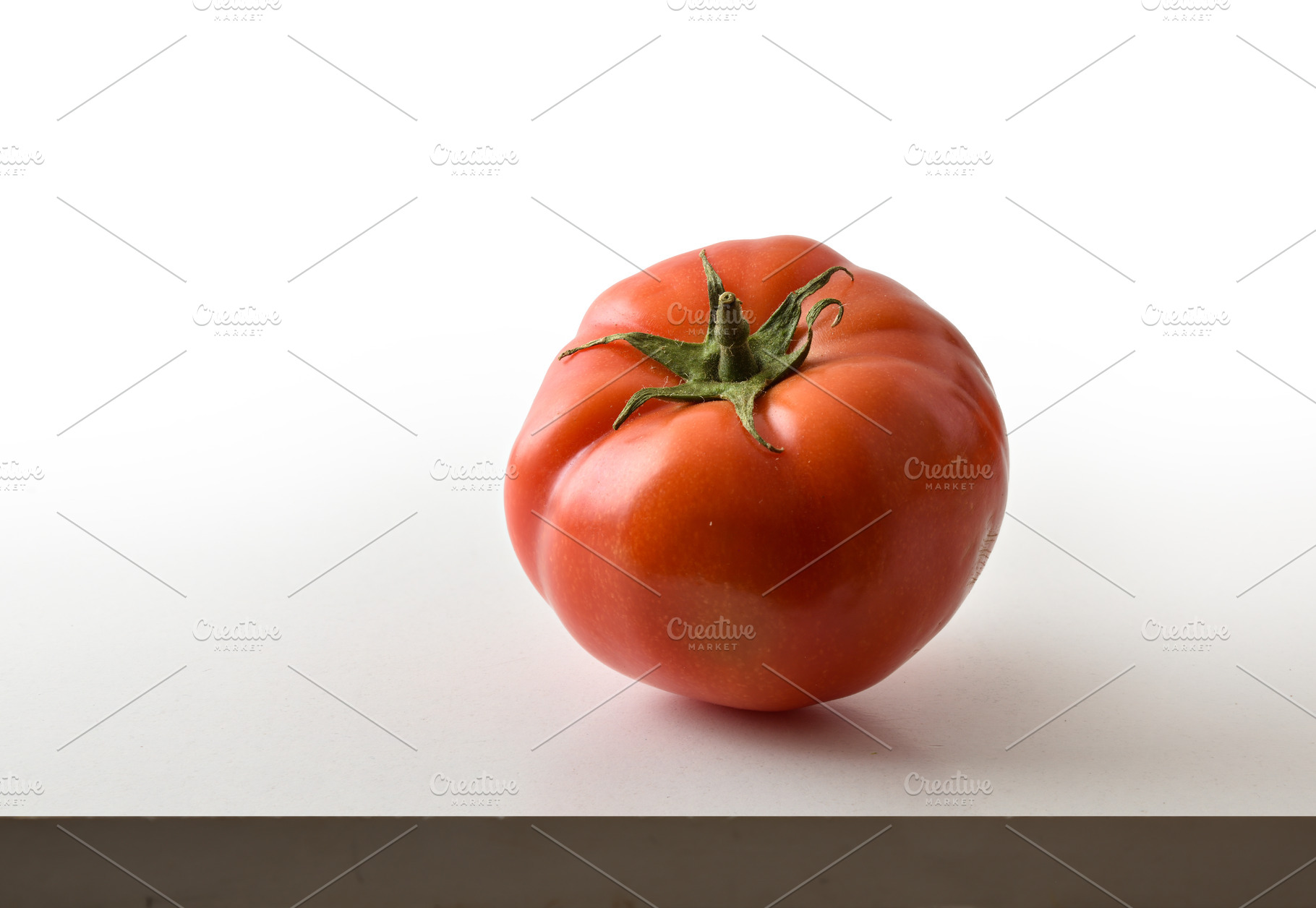 Single Fresh Tomato on White Background, a Food & Drink Photo by Davizro's Market