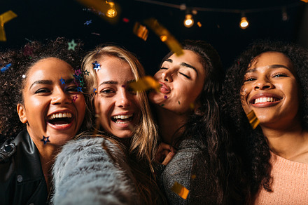 Four laughing girls taking selfie, a Person Photo by Artem Varnitsin