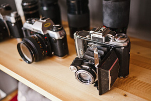 Vintage cameras stock photo containing workspace and desk