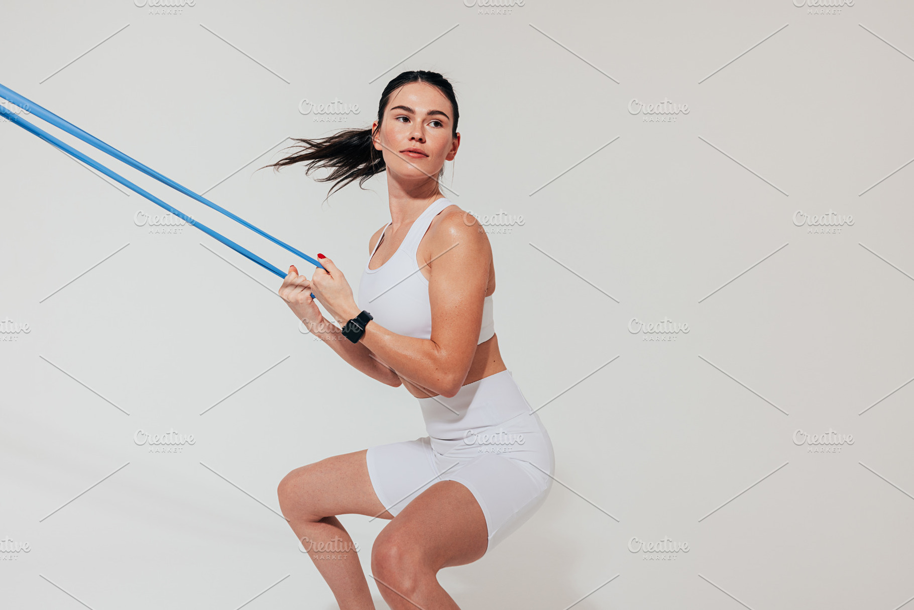 Young woman practicing squats, a Sports & Recreation Photo by Artem Varnitsin