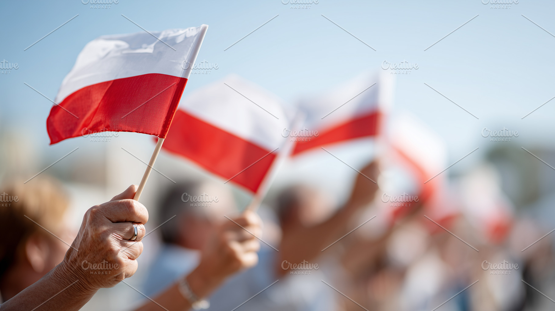 People holding Polish flags during, a Person Photo by MistyDay