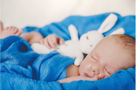 Newborn baby sleeping on a blue, a Person Photo by yanadjana