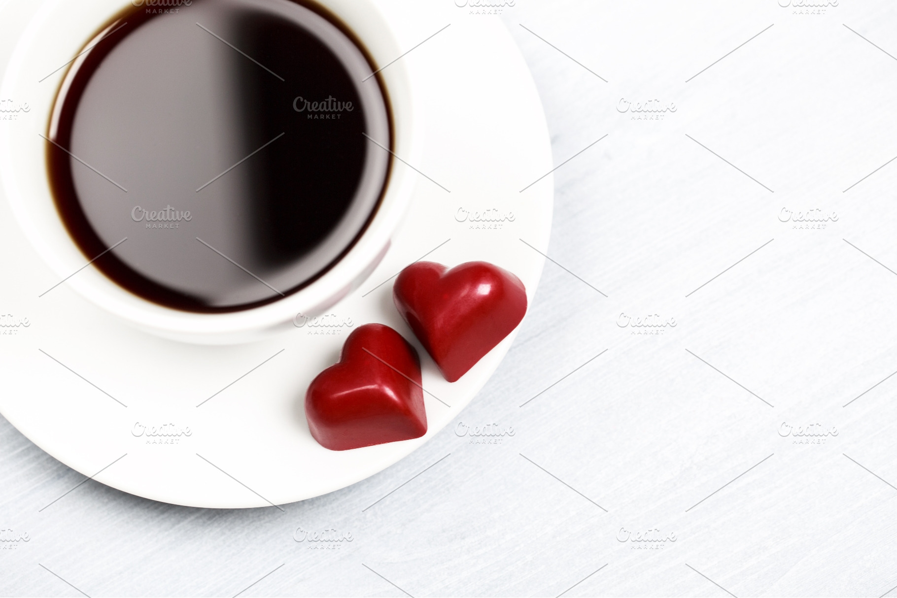 Coffee cup and red heart candies on, a Food & Drink Photo by Anna Efetova