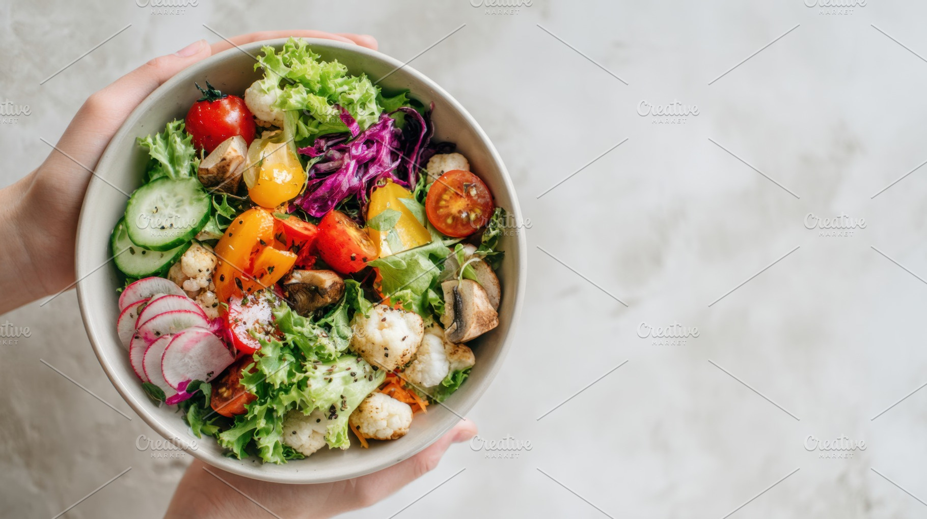Fresh salad in a bowl held by hands, a Photo by Beautiful things