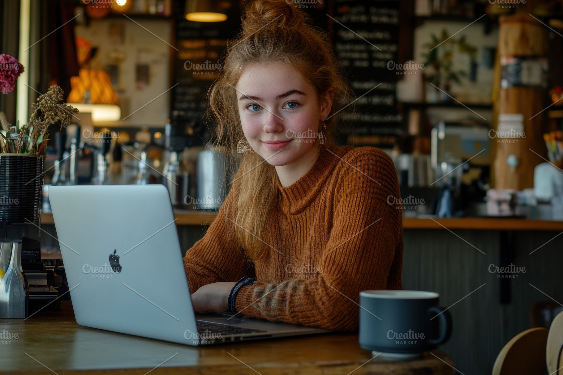 A young woman working on her laptop, a Photo by Pavel_design