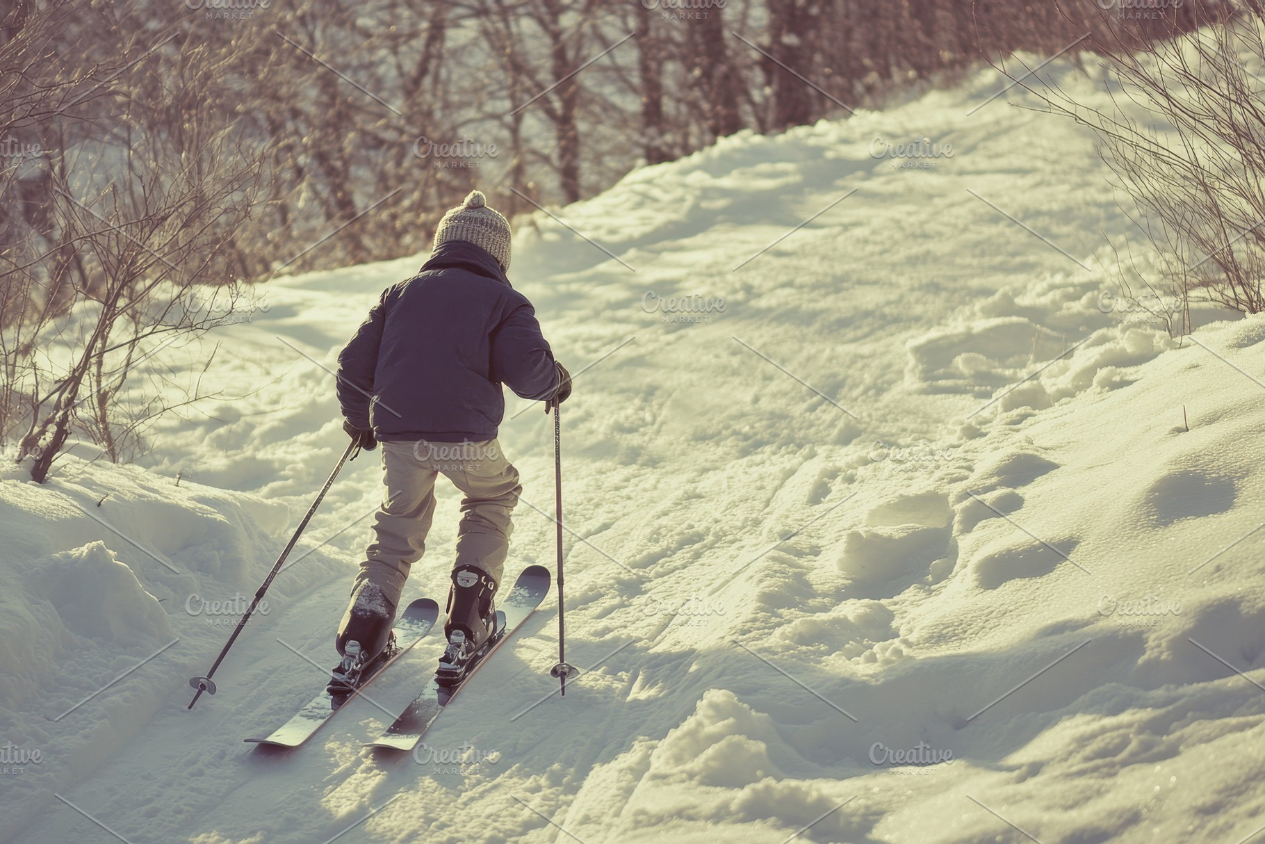 Child enjoys skiing on vintage skis, a Photo by Pavel_design