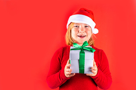 Christmas holiday background with funny girl, a Holiday Photo by Rimma