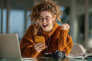Happy woman celebrating success on p, a Photo by Pixeness Studio