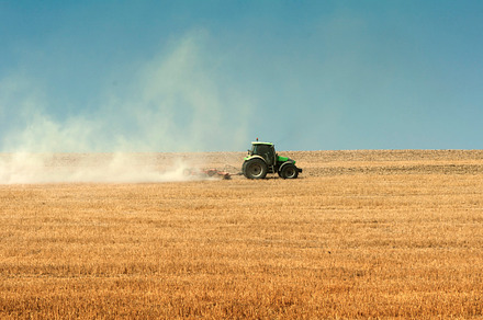 Tractor plowing field stock photo containing farming and field, an Industrial Photo by Deyan Georgiev