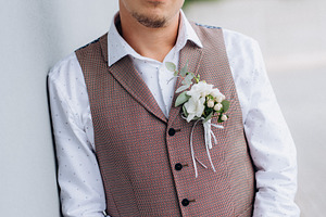 portrait of the groom in a gray suit and an orange vest, a Person Photo by Weddings, People, Travel