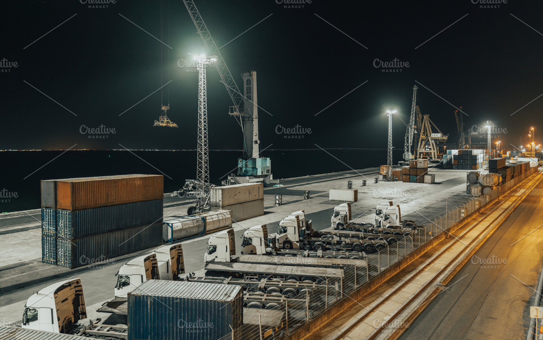 Night cargo port: trucks and cranes, an Industrial Photo by SkyNext