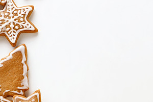 Christmas cookies with stars snowflakes and trees on white backg