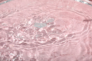 Concept of summer and freshness, water on pink background, a Food & Drink Photo by AtlasStudio PRO