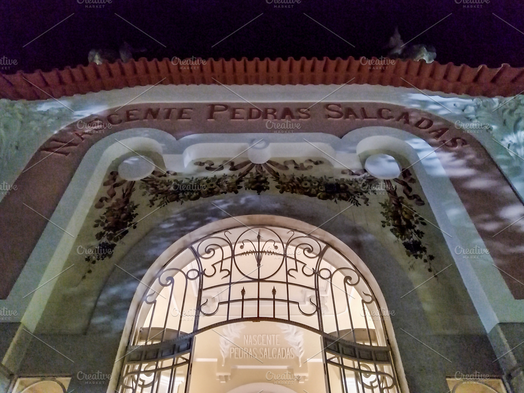 Low angle view of elegant building with lights on, pedras salgad, an Architecture Photo by DanFLCreativo