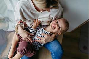 Beautiful mother hugging little son,, a Person Photo by HalfPoint