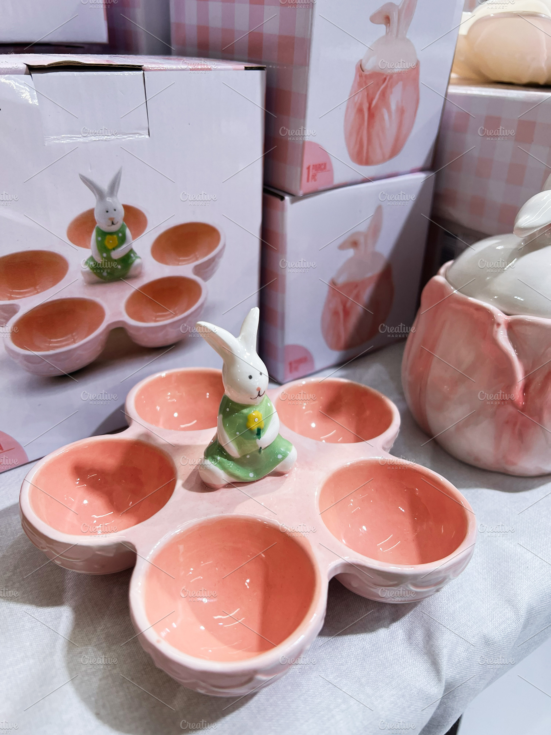 Ceramic bunny-themed serving dish in pink color with adorable design, a Photo by AS photostudio