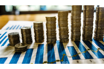 A businessman stacks coins in the, a Business Photo by ZinetroN