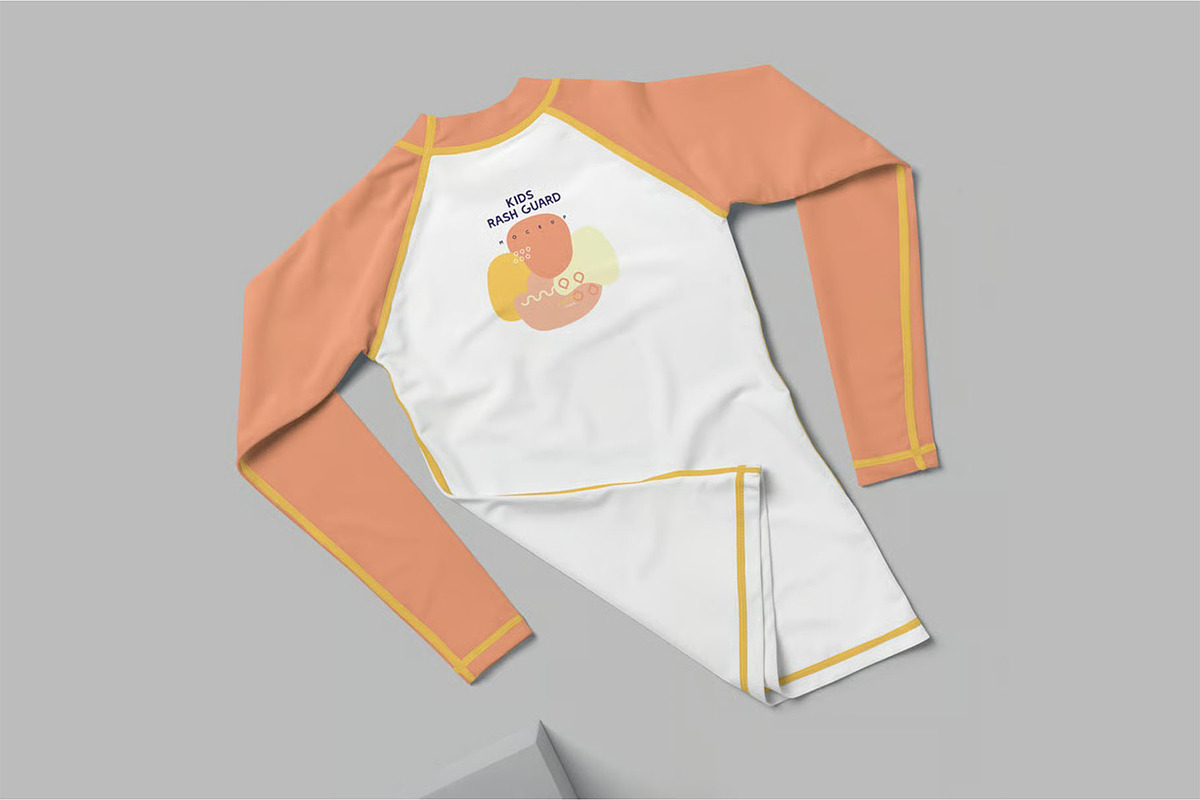 Kids Rash Guard Mockups, a Shirt Mockup by megostudi0 (Photo 6 of 7)