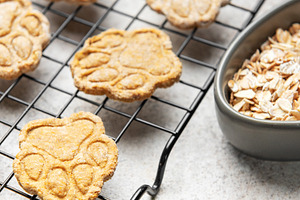 Homemade dog treats baking on cooling rack with oats, a Food & Drink Photo by Olena Rudo