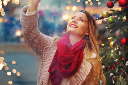happy blond girl in winter coat and