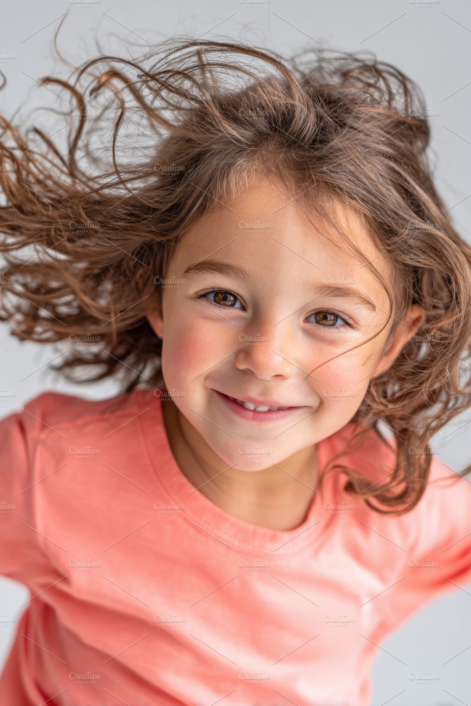 Cheerful girl with curly hair smiling, a Person Photo by AlyaAnd