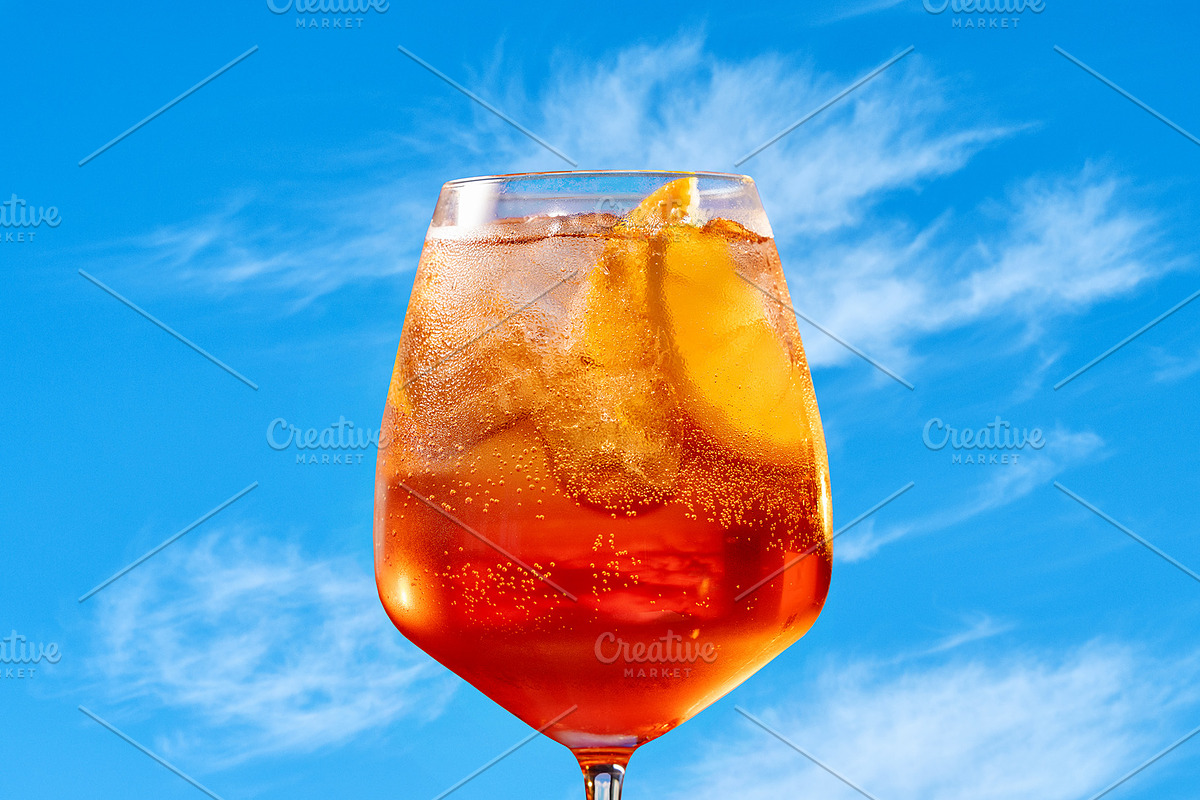 Glass of aperol spritz cocktail, a Photo by zeStudioPhoto (Photo 1 of 2)