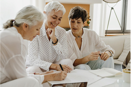 Three mature businesswomen talking