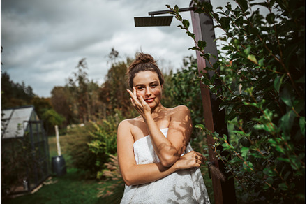 Beautiful woman resting in garden, a Beauty & Fashion Photo by HalfPoint